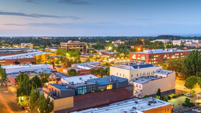 Town lit up under twilight